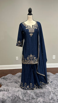 Model wearing navy blue silk sharara suit with silver embroidered kurta, wide-flared pants and matching dupatta – Spark In Style