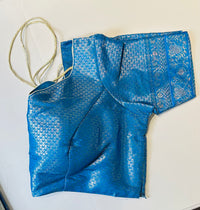 Blue silk saree with silver woven floral motifs and tassel pallu